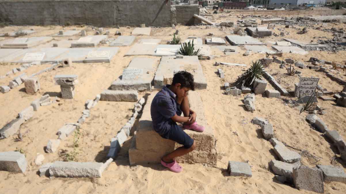 Innocence suspended between rubble and graves… a Gazan child converses with absence through his tears