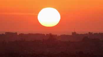 The sun embraces Gaza, embodying the essence of sacrifice and devotion
