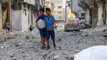 Small faces stealing life from the jaws of war